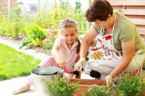 Gardeners in Bellingham maintaining a lush green residential garden
